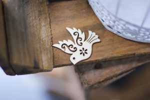 image of a wooden dove on a wooden crate